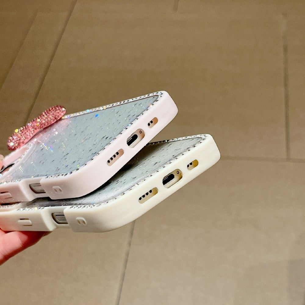 EIDERWOOD iPhone 16 Hybrid Deksel med 3D Sløyfe og Rhinestones - Gjennomsiktig / Rosa